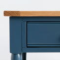 Close up of the painted blue solid wood frame on the Chichester Stiffkey Blue Coffee Table
