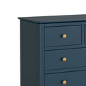 close up of sleek top edge and gold handles on the Stirling Blue 2 over 3 Chest of Drawers
