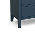 close up of tapered legs on the Stirling Blue 3 over 3 Chest of Drawers