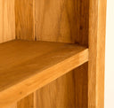 Lanner Oak Narrow Bookcase mid shelf corner view