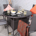 Malaga 4 Seat Stacking Rattan Garden Dining Set close up of table