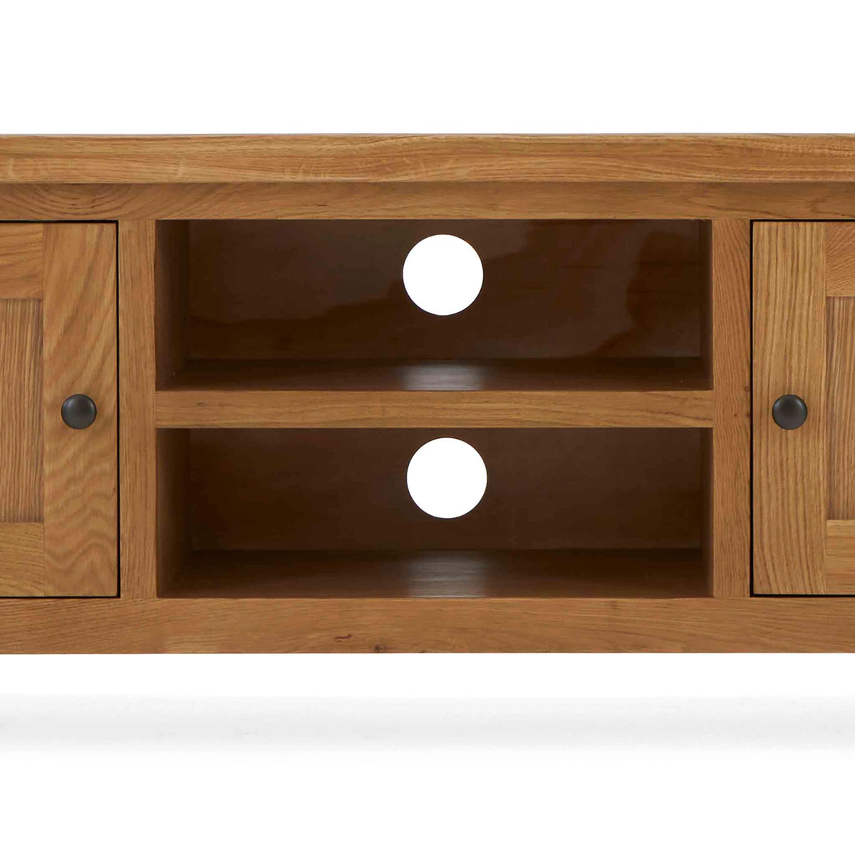 Zelah Oak 120cm TV Stand - Close up of shelving and cable access holes