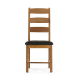 Wooden chair with black cushioned seat and ladder-style back.