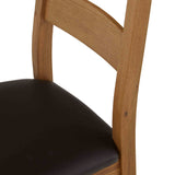 Oak chair with dark brown cushioned seat.