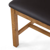 Dark brown leather seat atop light oak wood chair legs.