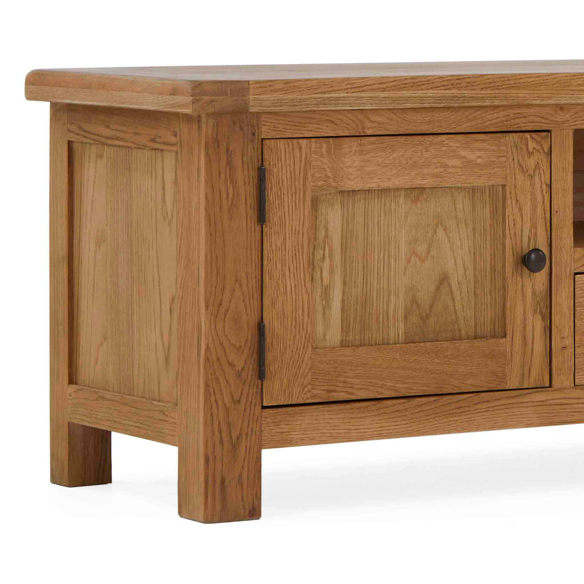 A wooden coffee table with a closed cabinet door, on a plain background, the door has a black handle.