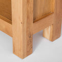 close up of solid wood legs on Surrey Oak Slim Bookcase