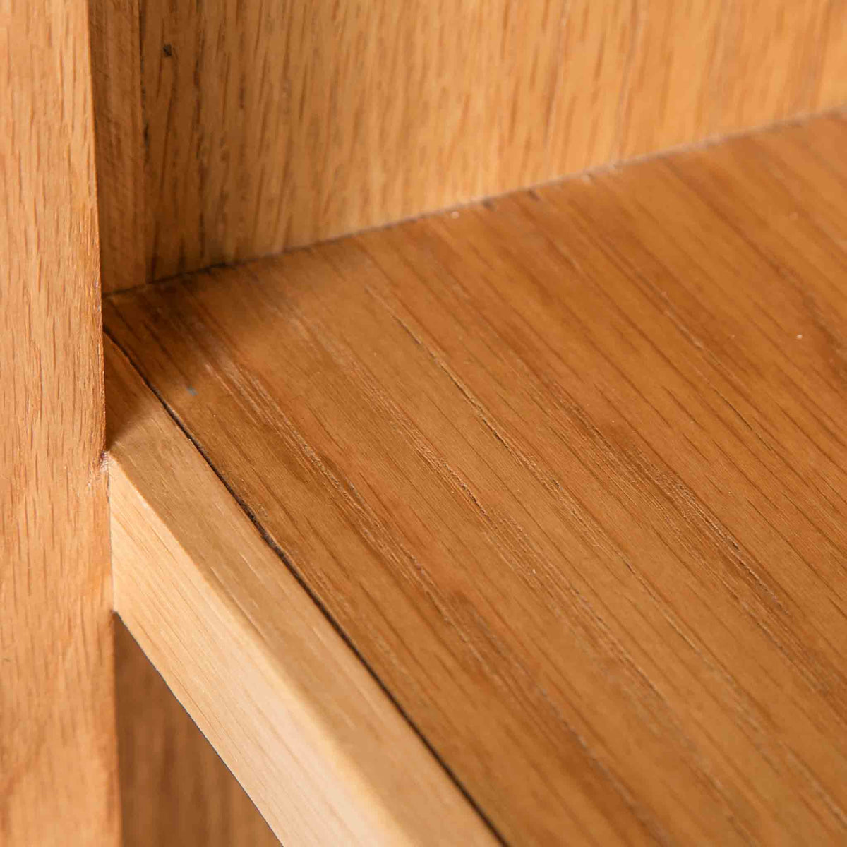 close up solid wood frame on the Surrey Oak Slim Bookcase