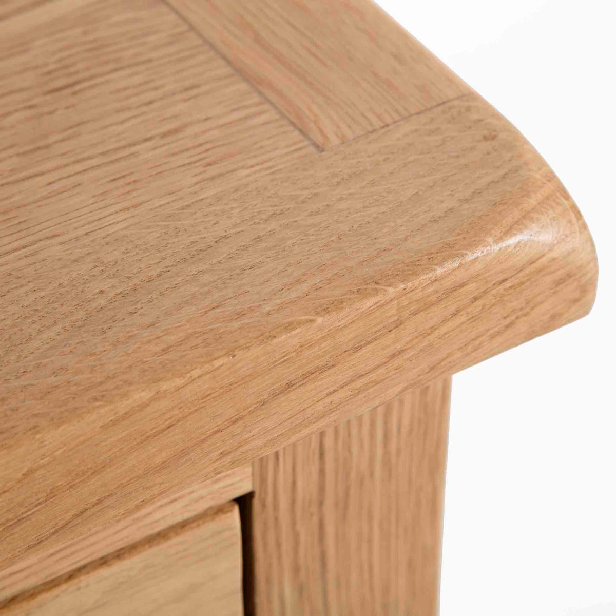 Surrey Oak 2 Over 3 Chest of Drawers - Close up of top corner of drawers