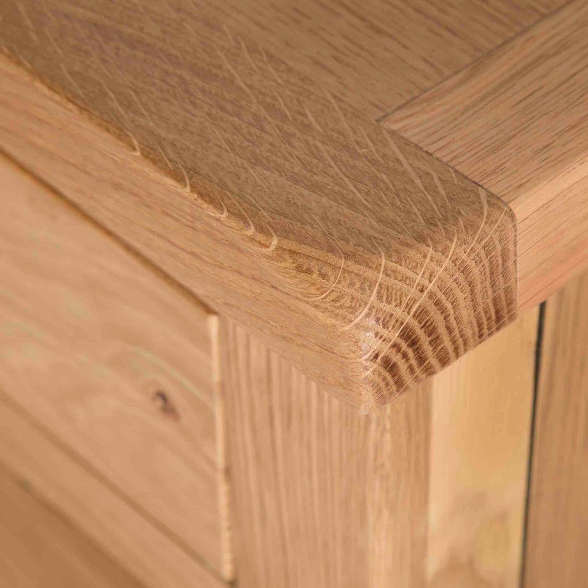 Surrey Oak 2 Over 3 Chest of Drawers - Close up of top corner of drawers