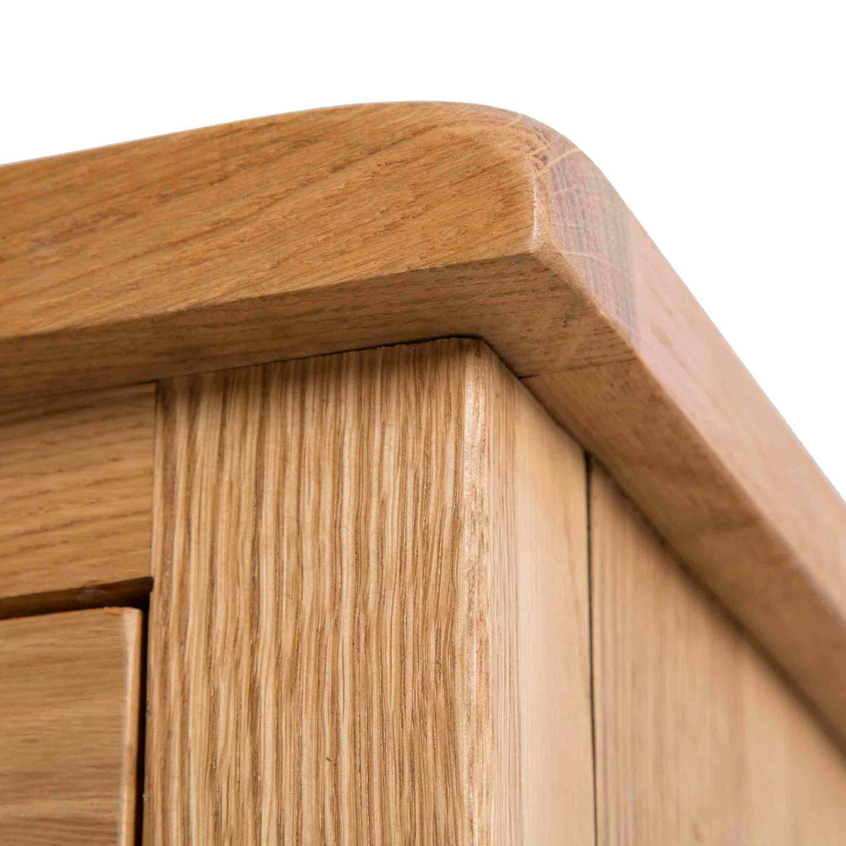 Surrey Oak 2 Over 3 Chest of Drawers - Close up of top corner of drawers