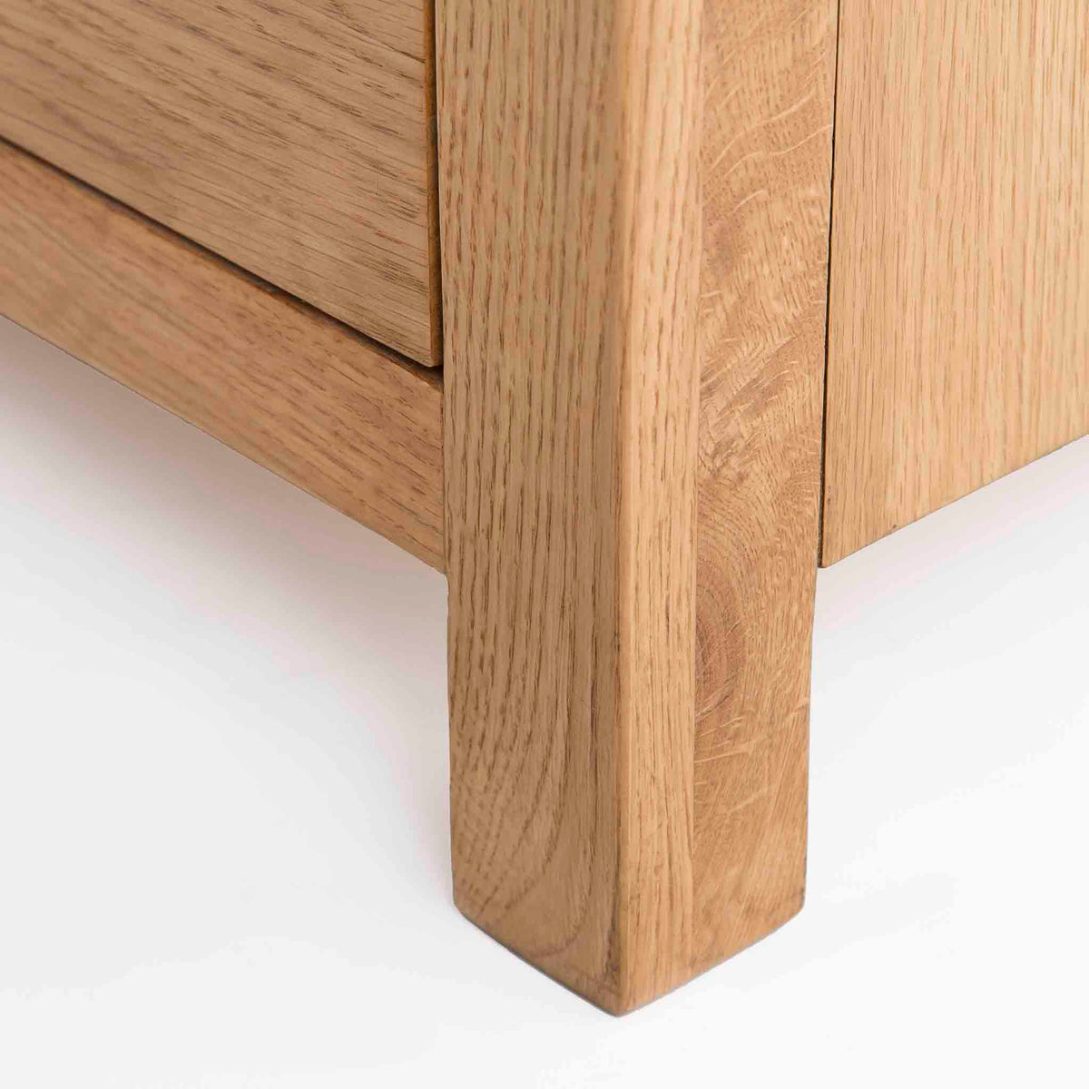 Surrey Oak Large Chest Of Drawers - Close up of foot of drawers