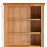 A simple wooden bookshelf with three shelves, empty, against a white background.