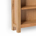 London Oak Slim Bookcase - Close up of bottom shelf and feet of bookcase