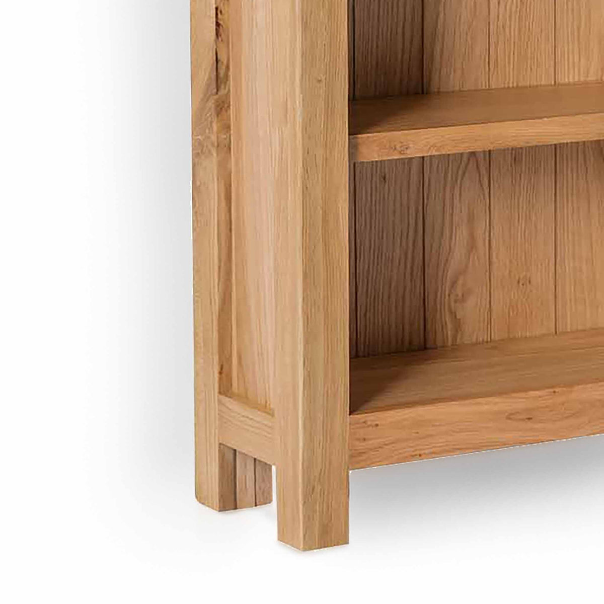 London Oak Slim Bookcase - Close up of bottom shelf and feet of bookcase