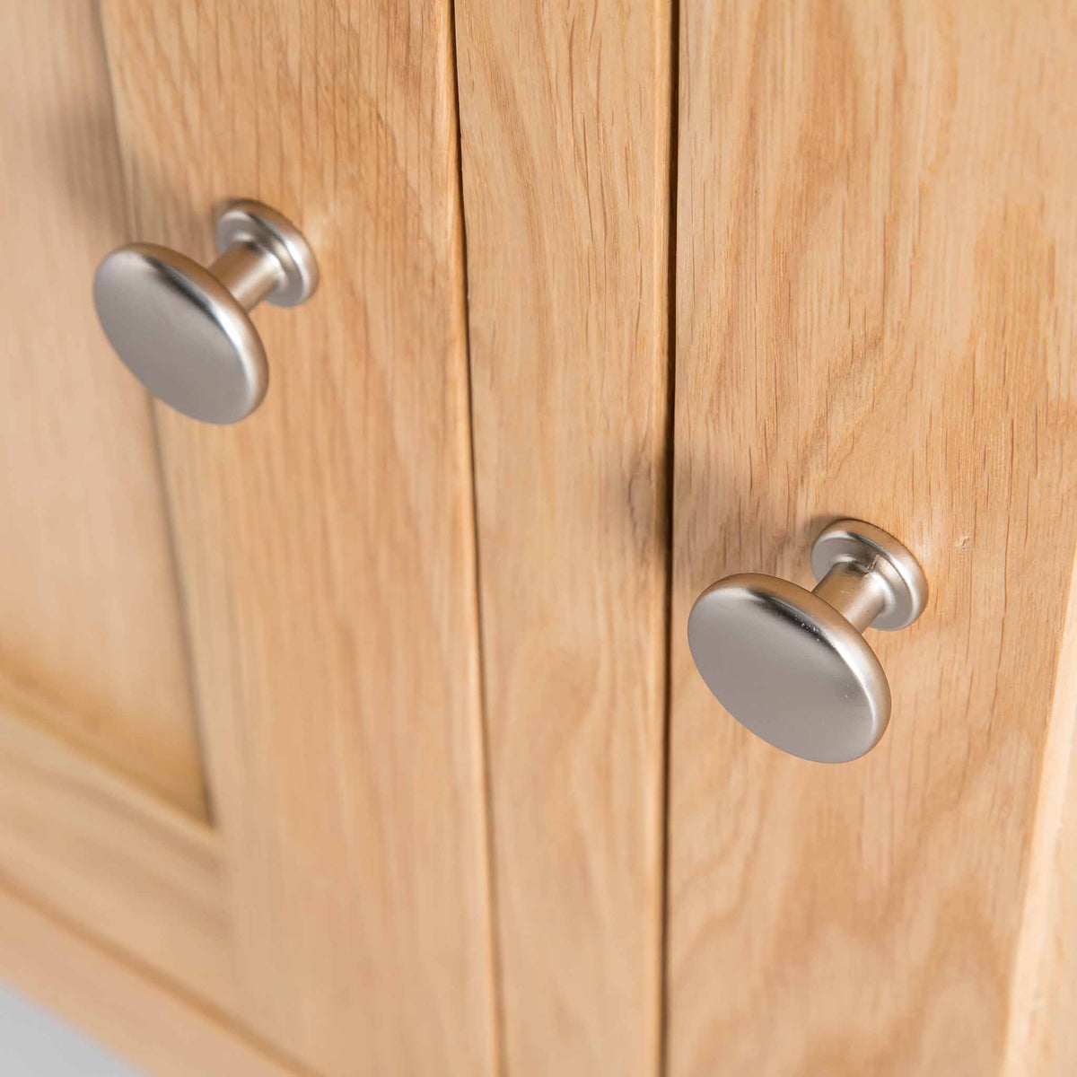 close up of metal door knobs on London Oak Large Sideboard