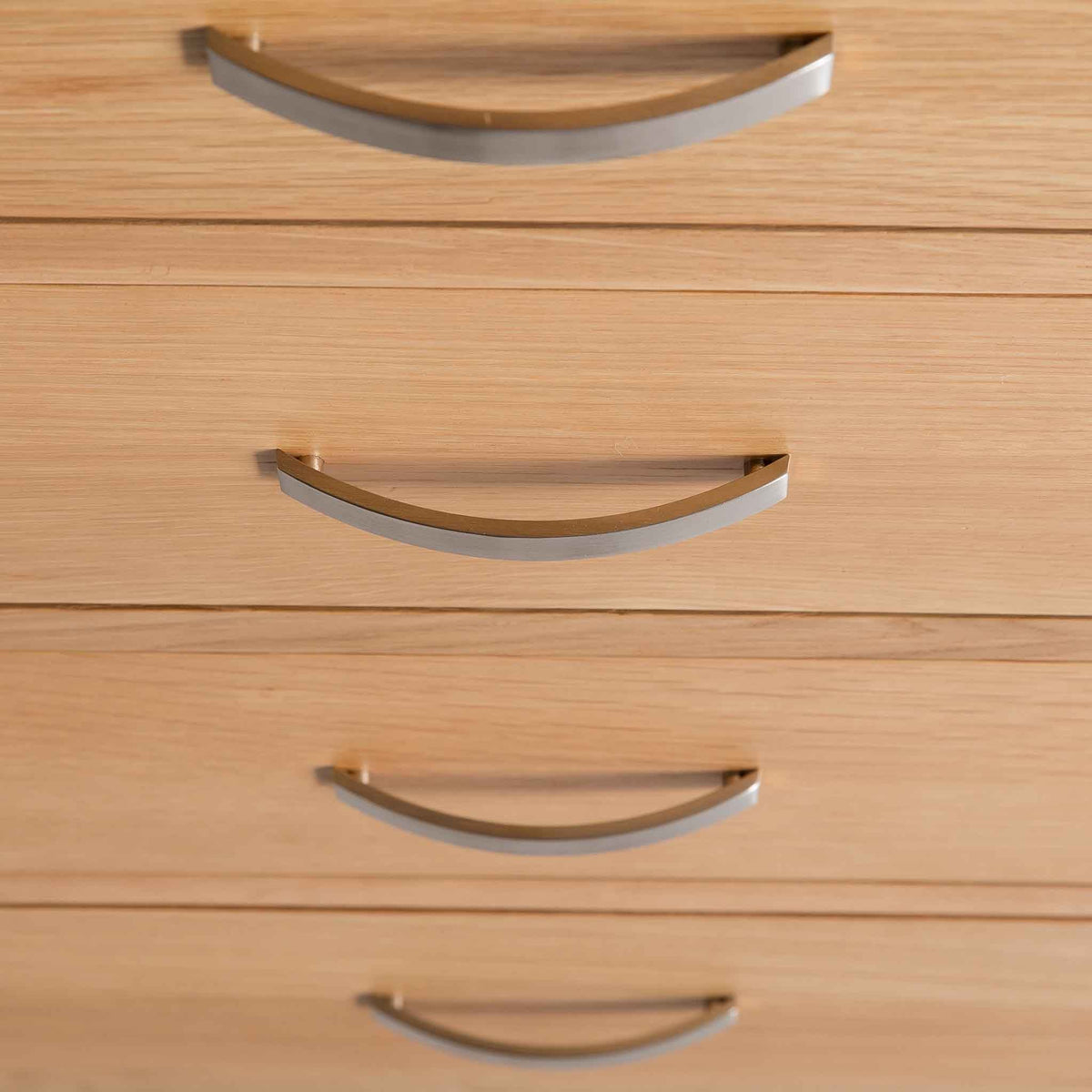 close up of the tiered drawer handles on the London Oak 2 over 3 Chest of Drawers