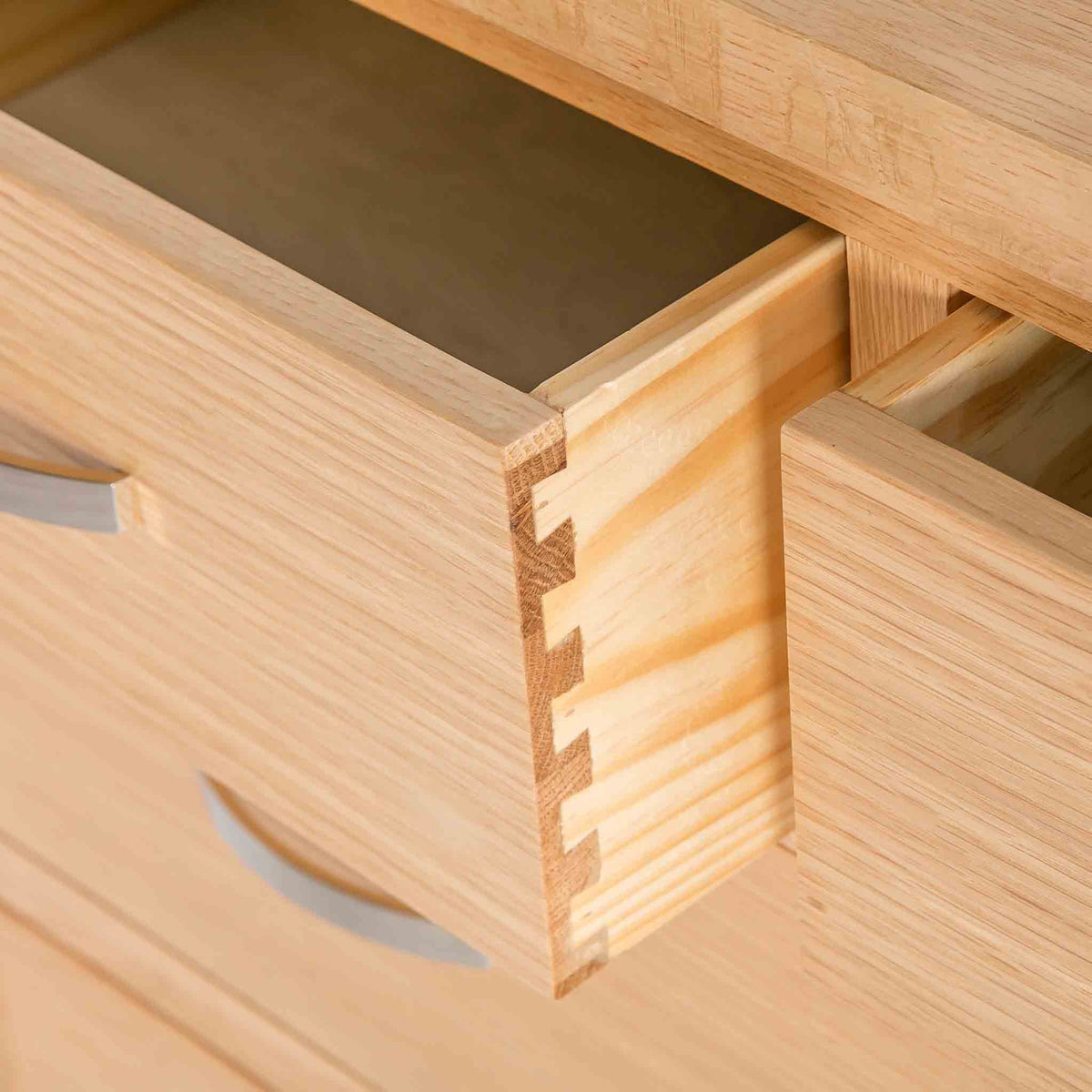 close up of the dovetail joints on the London Oak 2 over 3 Chest of Drawers