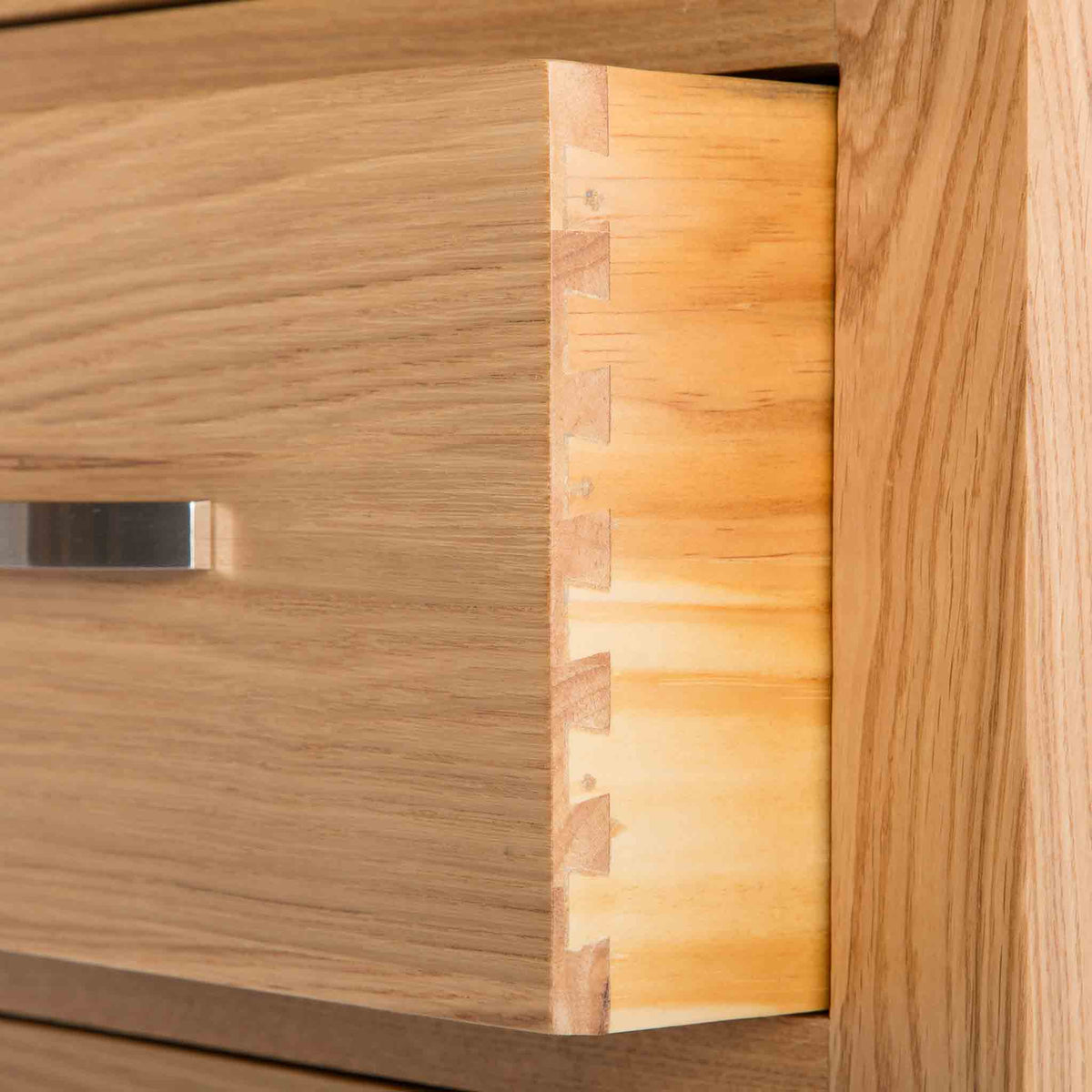 close up of the dovetail joints on the  London Oak Tallboy Chest