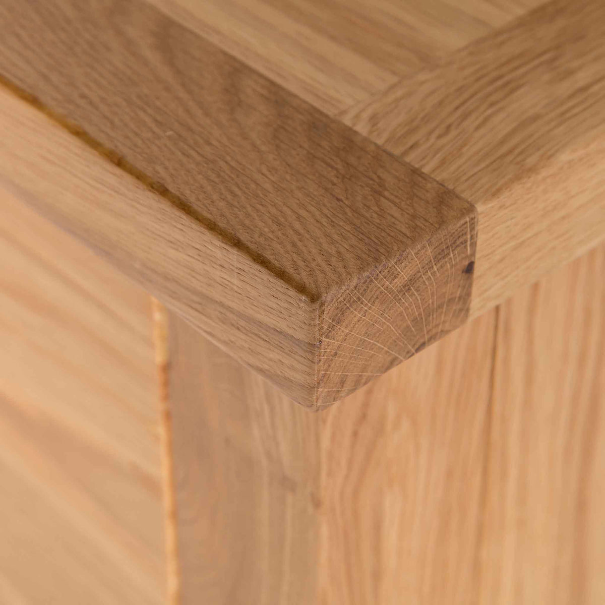 close up of the solid oak top corner on the London Oak Tallboy Chest