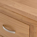 close up of the oak top edge on the London Oak Tallboy Chest by Roseland Furniture. 