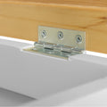 A metal hinge connects a wooden piece to a white surface, illustrating the hardware in use within a simple, clean environment.