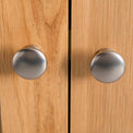 close up of metal round door knobs on the London Oak Mini Sideboard by Roseland Furniture. 