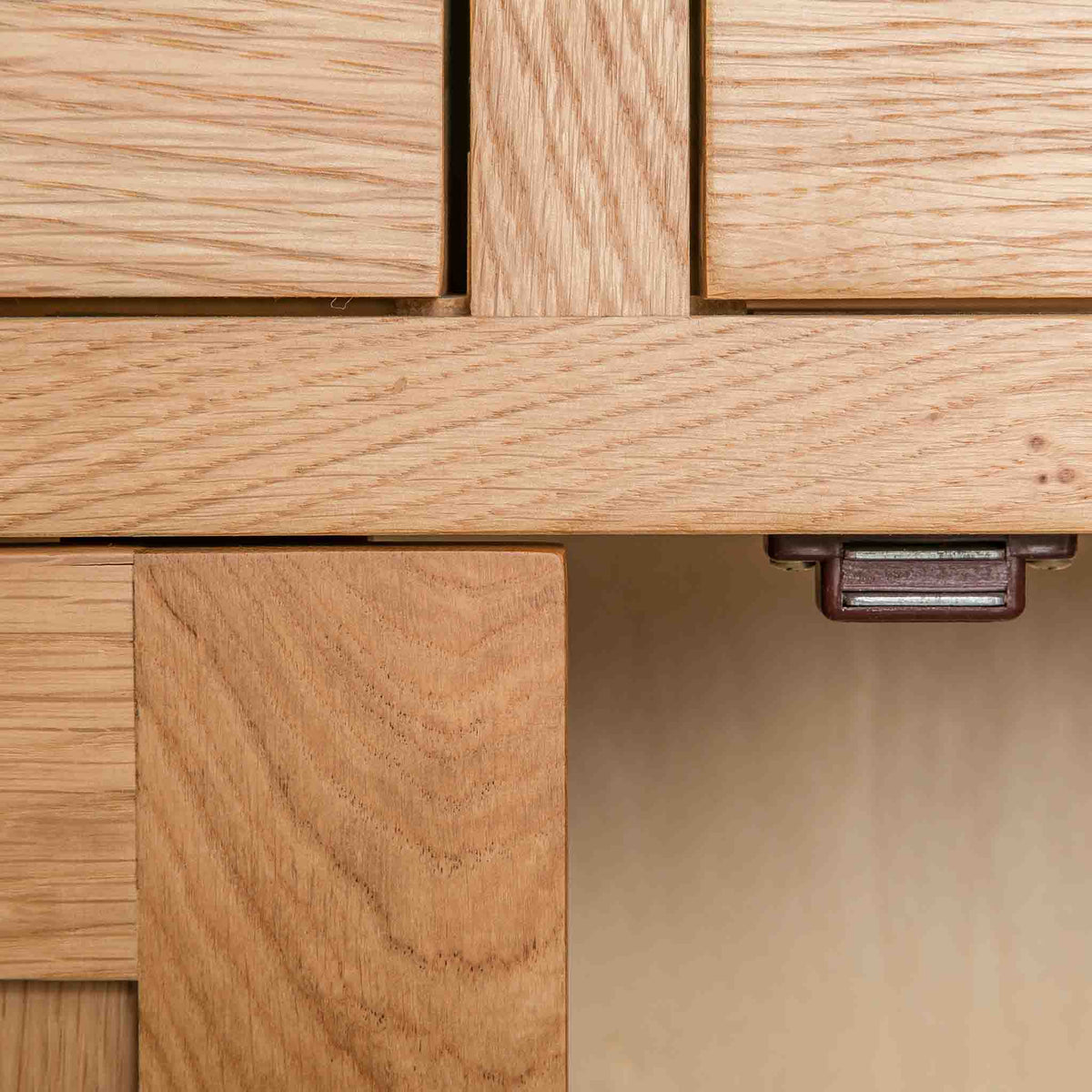 close up of the magnetic door catch on the London Oak Mini Sideboard by Roseland Furniture. 