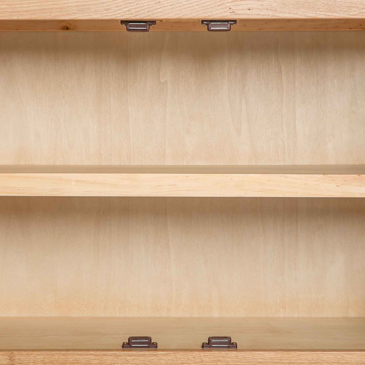 close up of the internal fixed shelf on the London Oak Mini Sideboard by Roseland Furniture. 