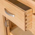 close up of the dovetail joints on the London Oak Mini Sideboard by Roseland Furniture. 