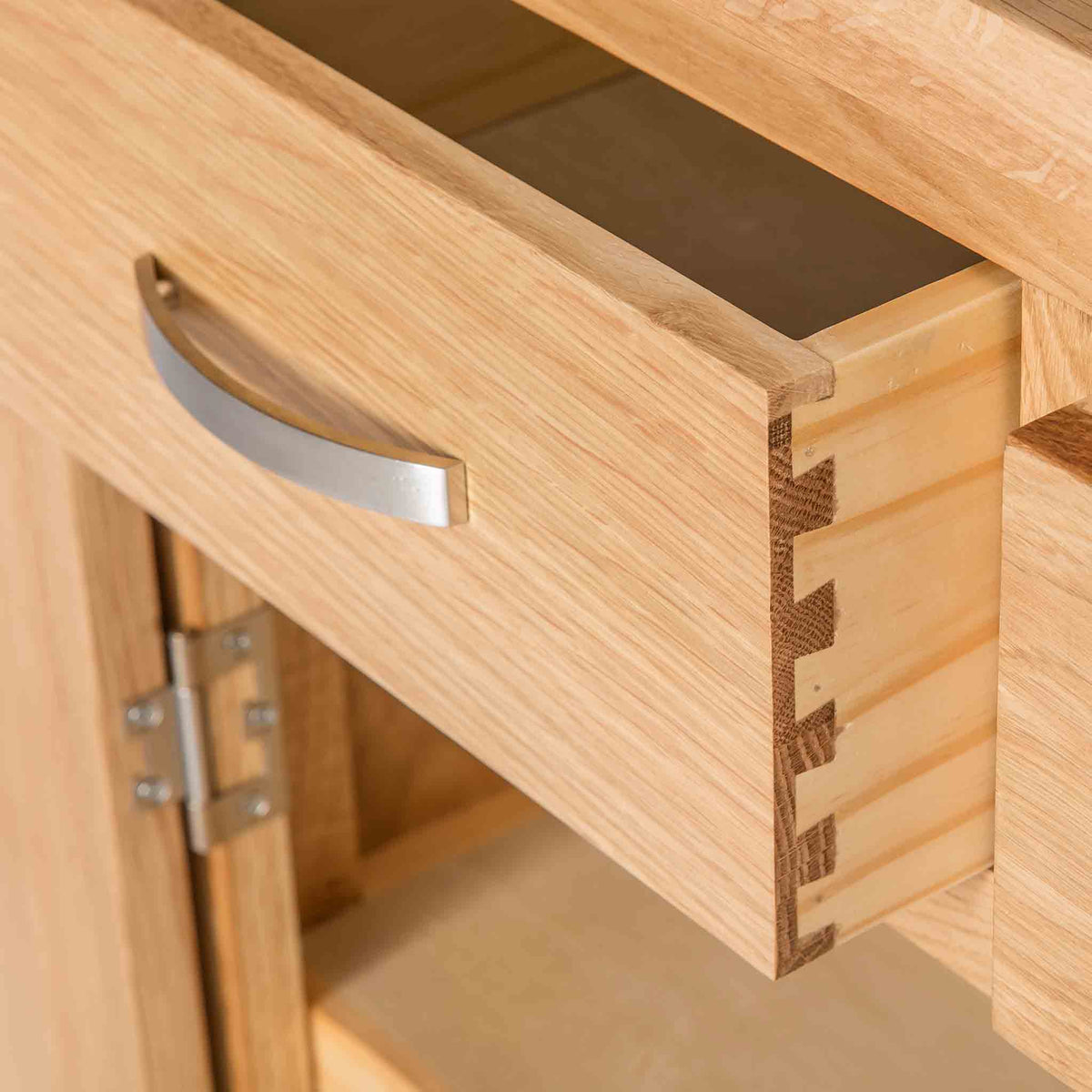 close up of the dovetail joints on the London Oak Mini Sideboard by Roseland Furniture. 