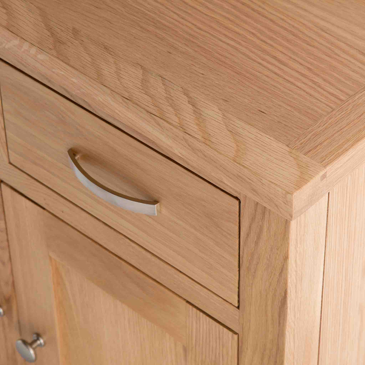 close up of the solid oak top edge on the London Oak Mini Sideboard by Roseland Furniture. 