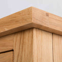 close up of the solid oak top corner on the London Oak Mini Sideboard by Roseland Furniture. 