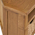 Zelah Oak Corner TV Stand with Baskets - Close up of top front corner