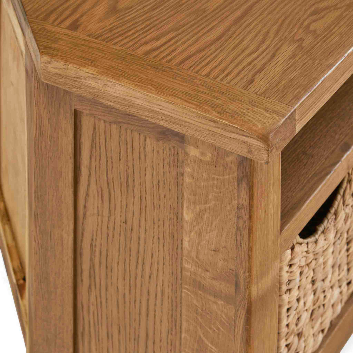 Zelah Oak Corner TV Stand with Baskets - Close up of top front corner