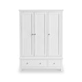 A white wooden wardrobe with three doors and two lower drawers stands isolated against a pure white background.