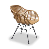 A wicker chair with a curved design on black metal legs against a white background.
