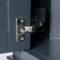 Close up of the cabinet door hinge on the Chichester Charcoal Black Corner Cupboard