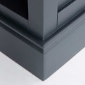 close up of the painted wooden pedestal base on the Chichester Charcoal Small Bookcase 