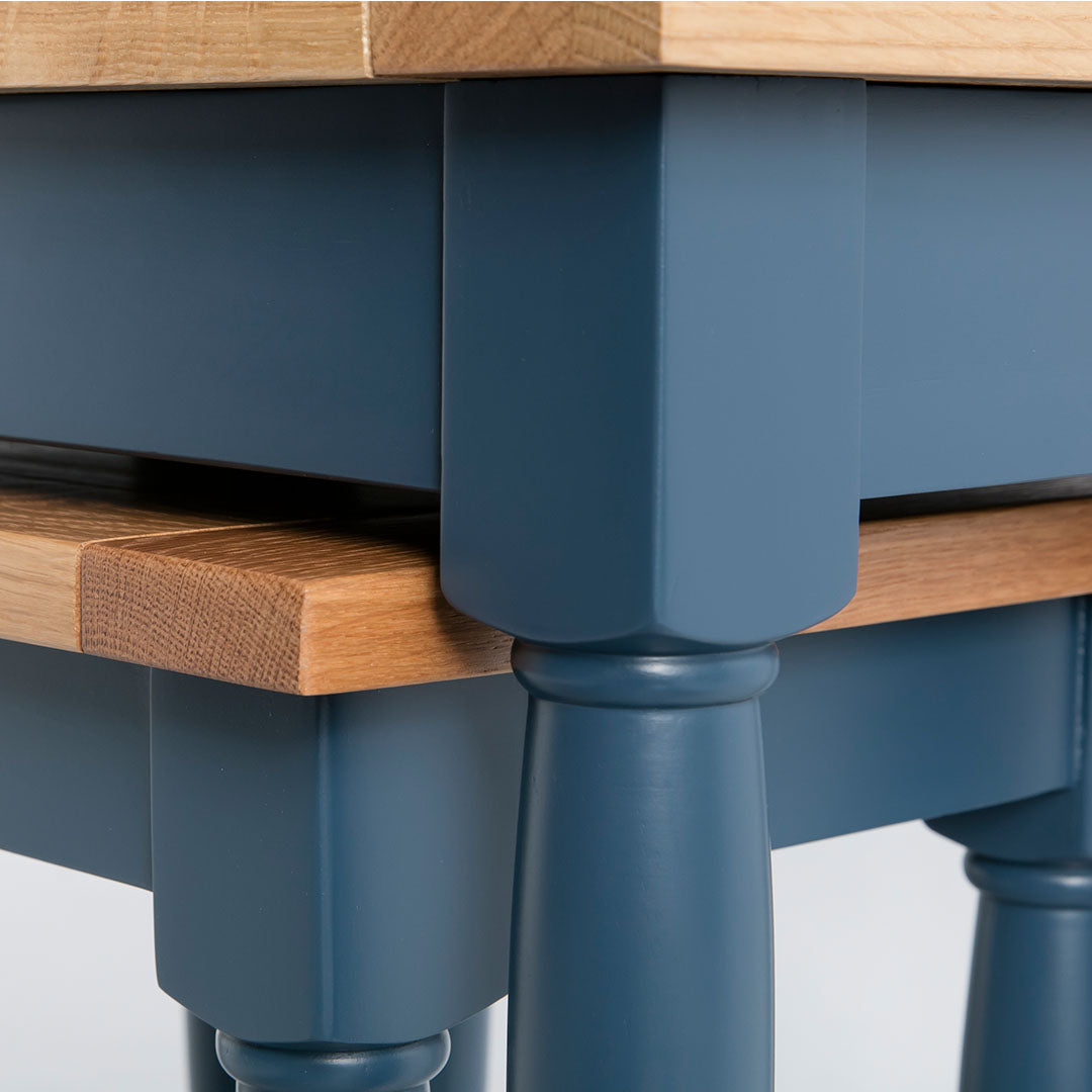 Close up of the painted blue solid wood frame on the Chichester Stiffkey Blue Nest of Tables