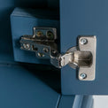 Close up of door hinge on the Chichester Stiffkey Blue Mini Cupboard