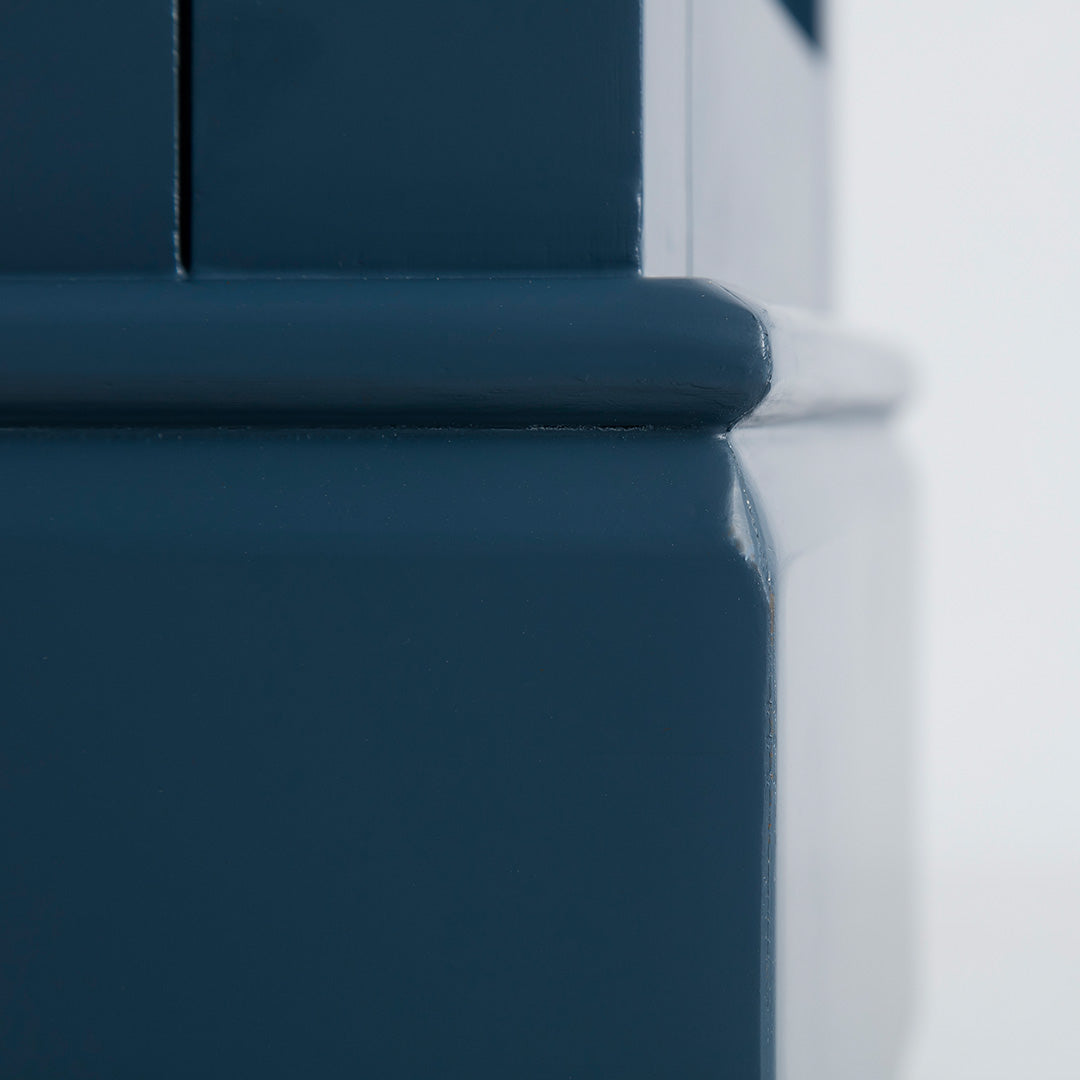Close up of solid wood base on the Chichester Stiffkey Blue Mini Cupboard