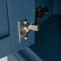 Close up of the door hinge on the Chichester Stiffkey Blue Corner Cupboard