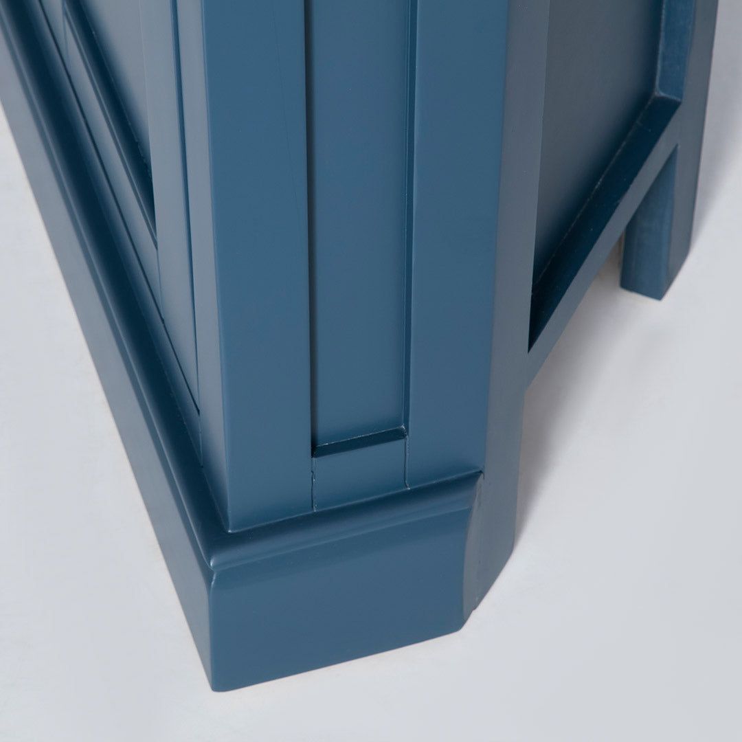 Side view of the solid wood base on the Chichester Stiffkey Blue Corner Cupboard