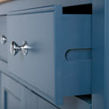 Close up of the wooden drawer runners on the Chichester Stiffkey Blue Large Sideboard