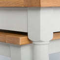 Close up of the cream painted solid wood frame on the Chichester Ivory Nest of Tables