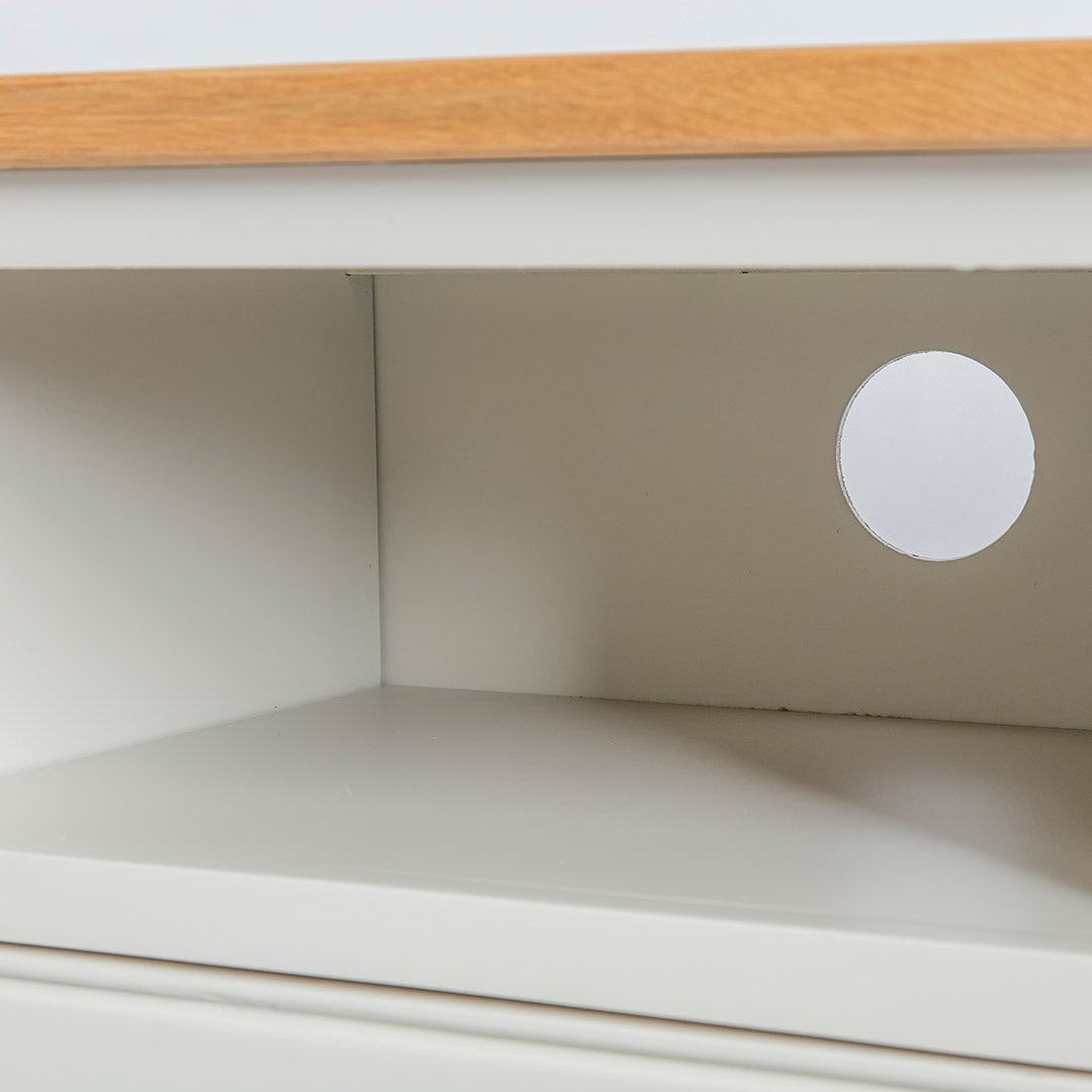 Close up of the open shelf on the Chichester Ivory Small TV Stand