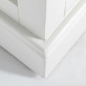 Close up of painted ivory plinth base on the Chichester Ivory Cream Mini Cupboard