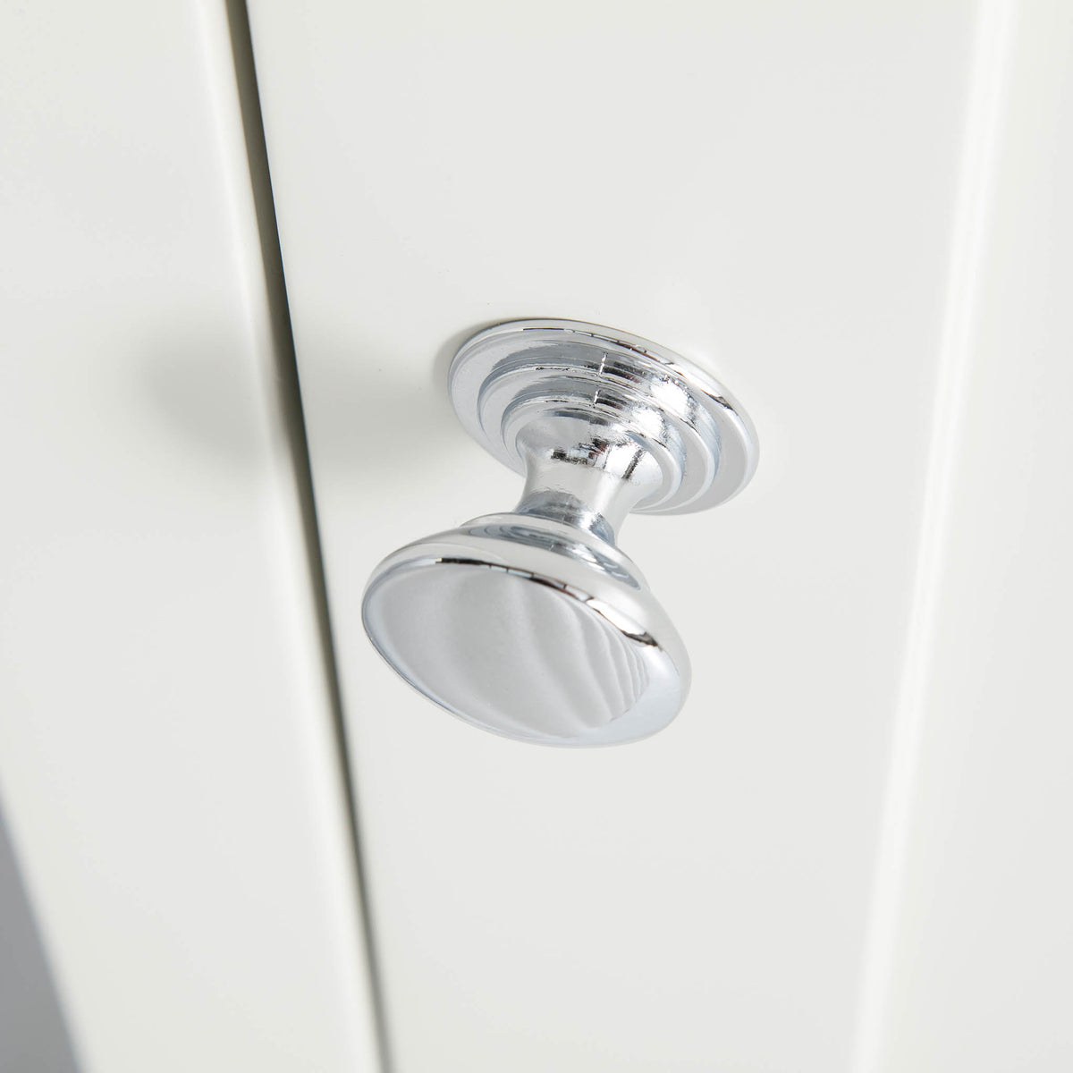 Close up of the silver door handle on the Chichester Ivory Cream Mini Cupboarda