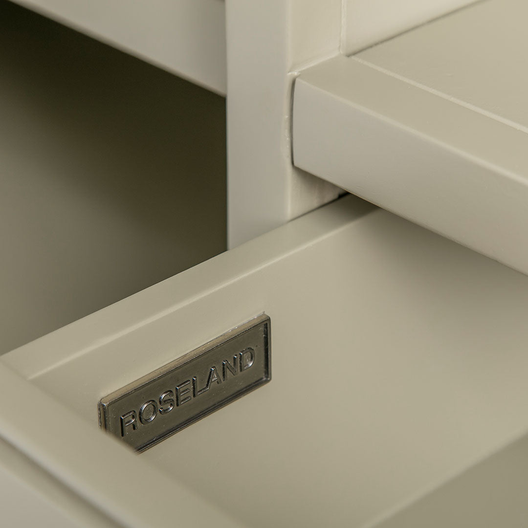 Close up of the metal Roseland drawer label on the Chichester Ledum Green Small TV Unit
